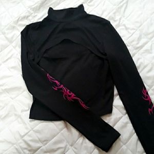 Cropped long sleeve top with chest cutout and purple tribal designs on sleeves.